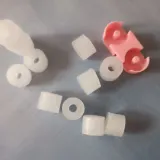 Paraffin wax refills of different sizes with a pink wax holder