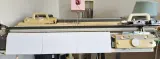 Lower front needle bed cover fitted on a Brother 5gg knitting machine