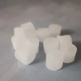 Pile of paraffin wax refills for machine knitting