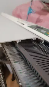 Upper back cover protecting the needles of a Brother 5gg machine