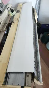 Magnetic cover protecting the full length of the 9mm needle bed