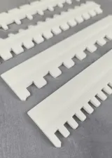 Close-up of the needle pusher teeth for ribbing on 7-gauge machines