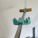 Paraffin wax holder clipped onto the Silver Reed yarn tension mast